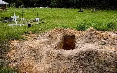 В Тринидаде нашли 56 тел в общей могиле на кладбище